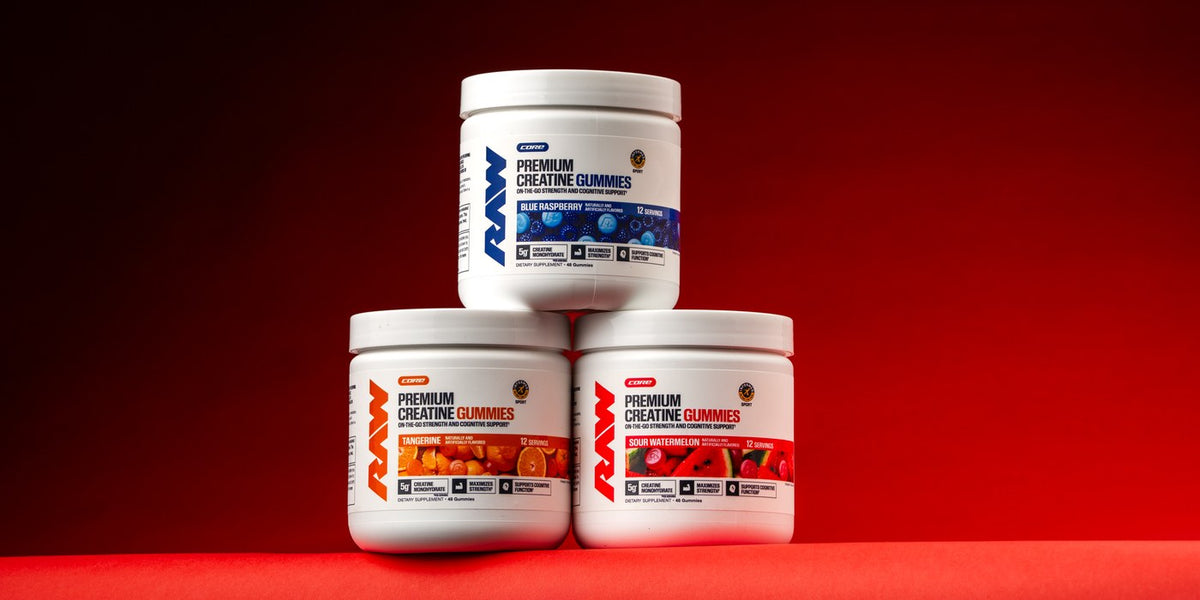 Three RAW Core Creatine Gummies 12-serving tubs in Blue Raspberry, Tangerine and Sour Watermelon on a red background.