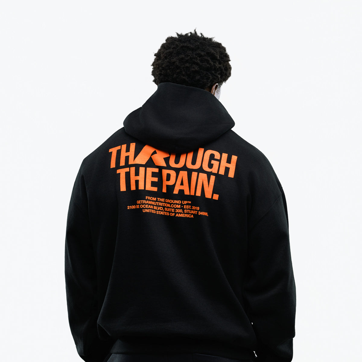 RAW Core Through The Pain Hoodie, black and orange, on model, back (men's)