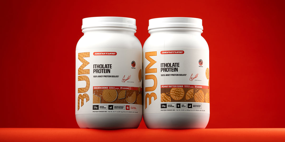 BUM Itholate Protein in Golden Cookie and Peanut Butter Cookie, two tubs side by side on a red background.