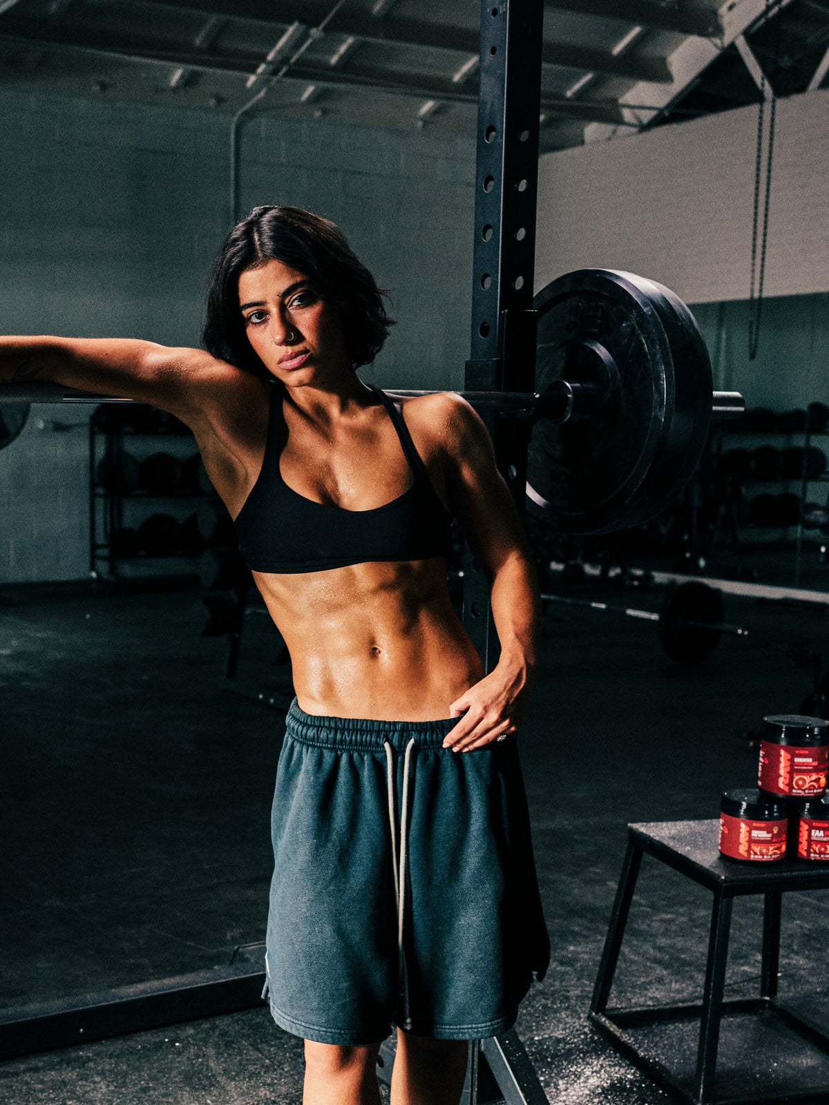 Sara Saffari in the gym with her RAW Sour Blood Orange signature stack