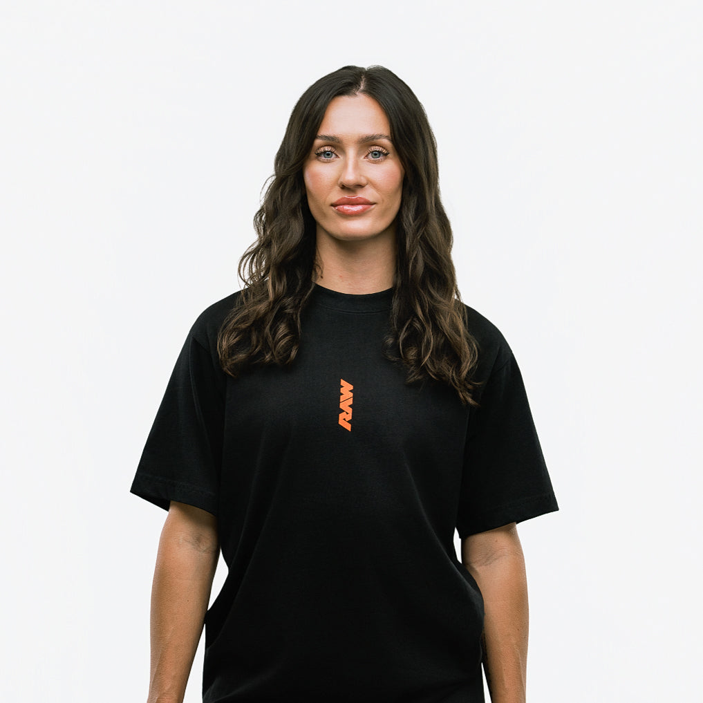 RAW Core Through The Pain T-Shirt, black and orange, on model, front (women's)
