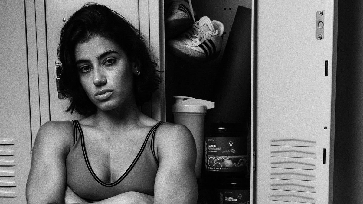 Sara Saffari in a locker room, arms crossed